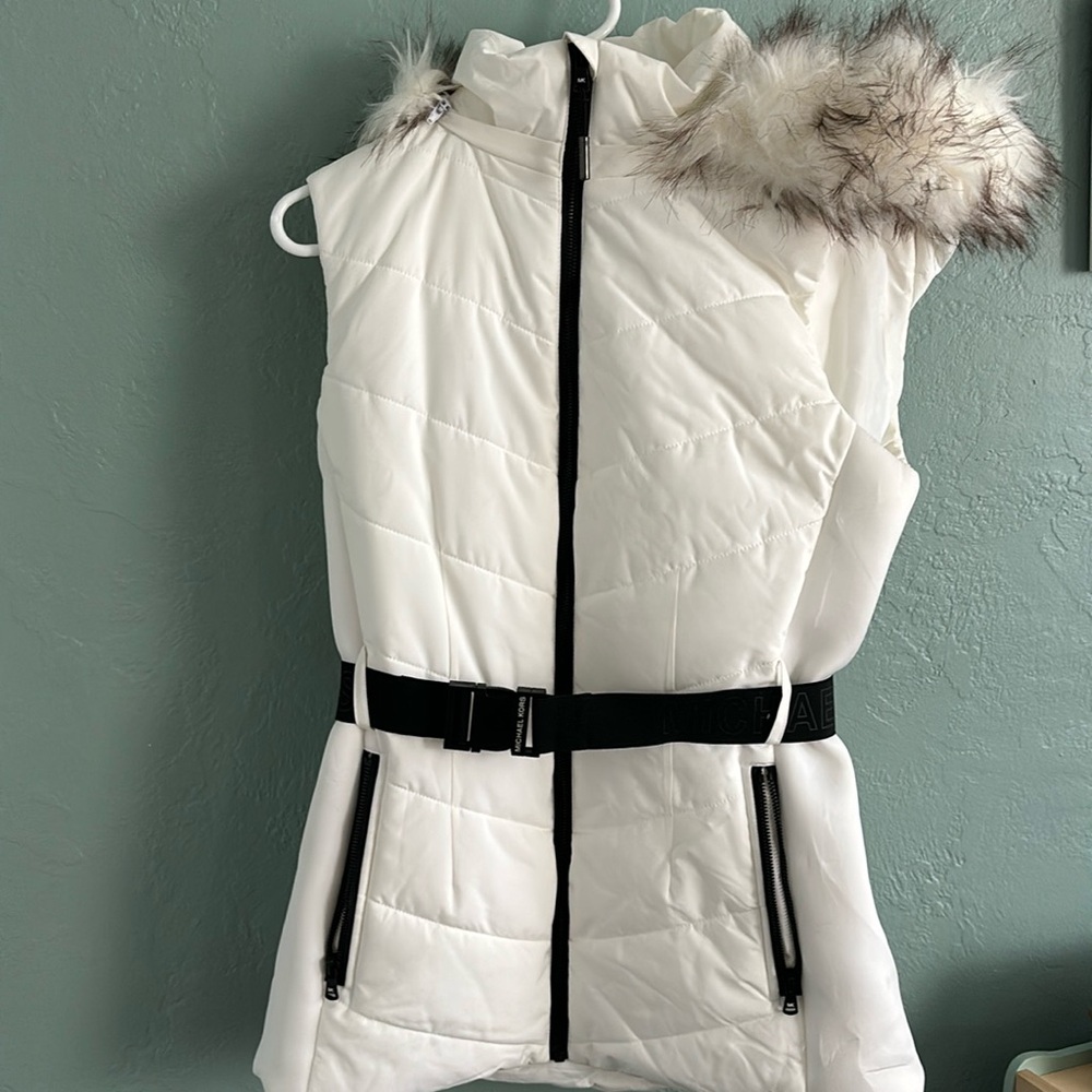 White Michael Kors winter vest with black belt and fur hood